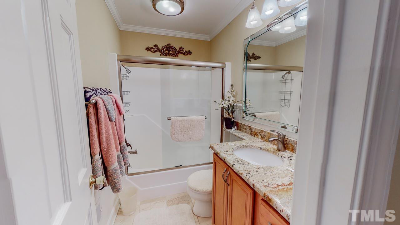 10 Canterbury Drive Roxboro, NC 27573 - Photo 18 of 30 a bathroom with a sink a toilet and shower
