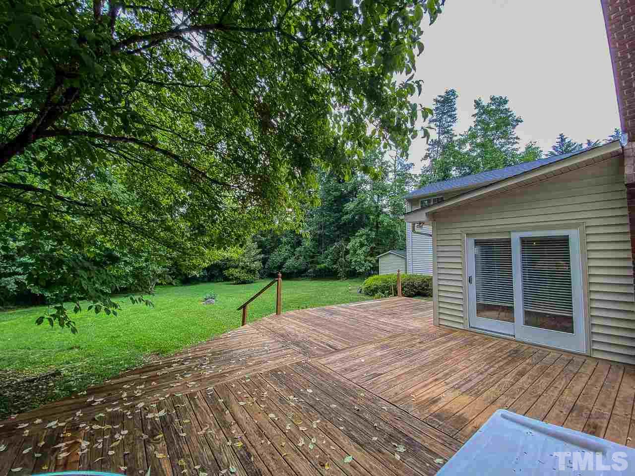 10 Canterbury Drive Roxboro, NC 27573 - Photo 22 of 30 a view of a backyard with a garden