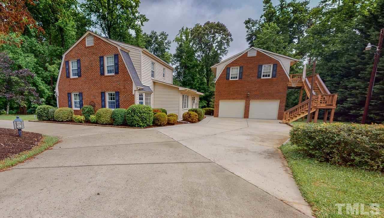 10 Canterbury Drive Roxboro, NC 27573 - Photo 26 of 30 a front view of a house with a yard and garage