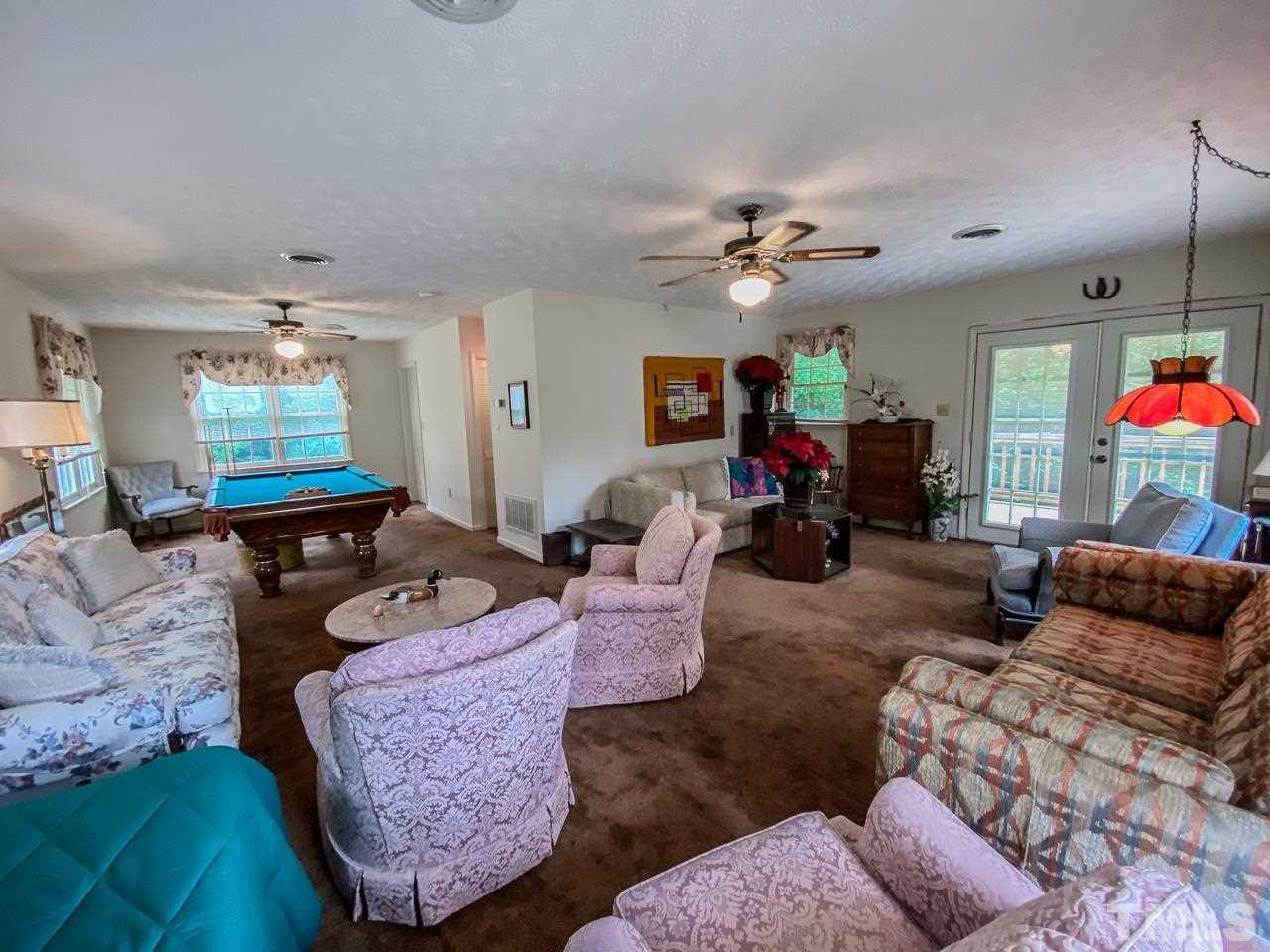 10 Canterbury Drive Roxboro, NC 27573 - Photo 28 of 30 a living room with furniture and a flat screen tv