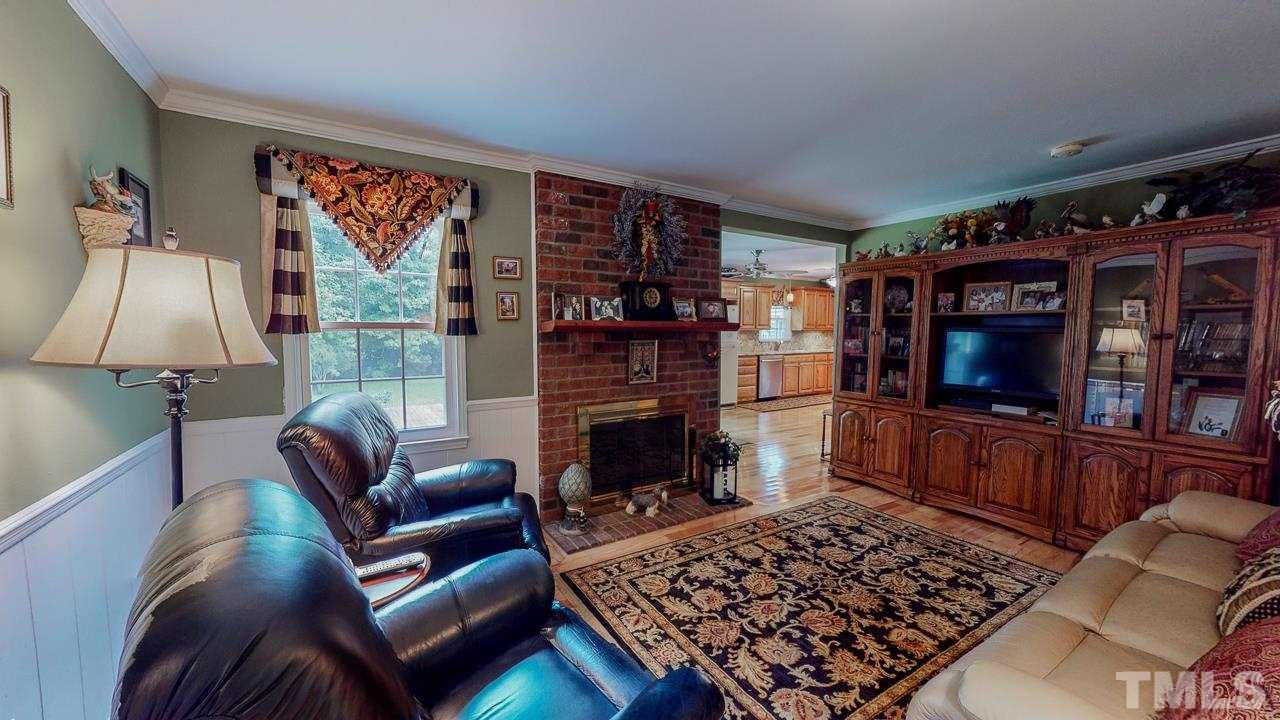 10 Canterbury Drive Roxboro, NC 27573 - Photo 8 of 30 a living room with furniture and a fireplace