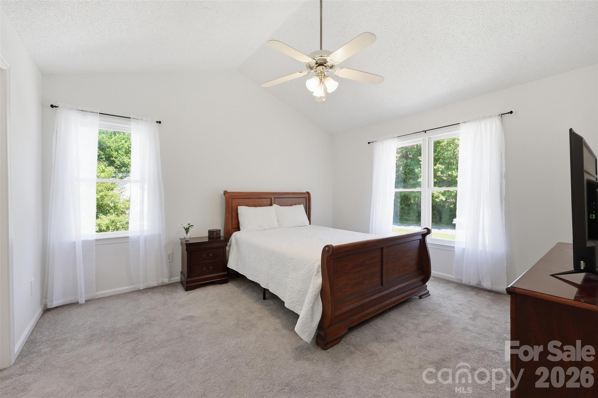 913 Pleasant Ridge Road Fort Mill, SC 29715 - Photo 14 of 40 a bed room with a bed and a television