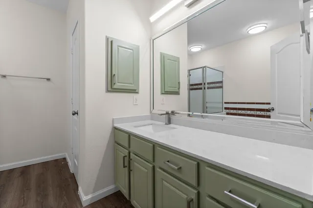 a bathroom with a tub and shower