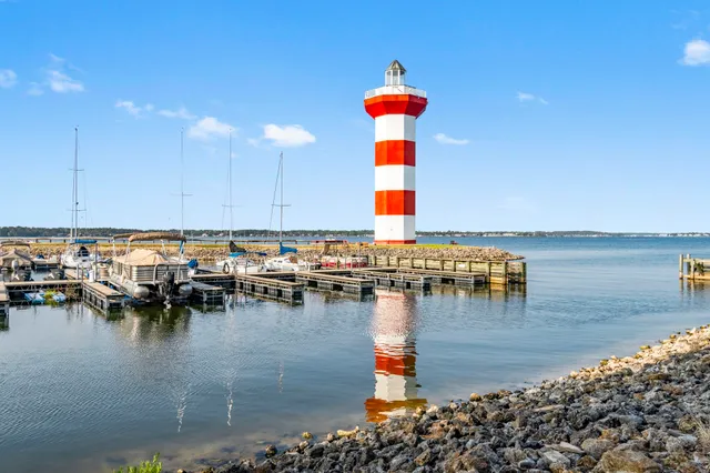 a view of a terrace with lawn chairs