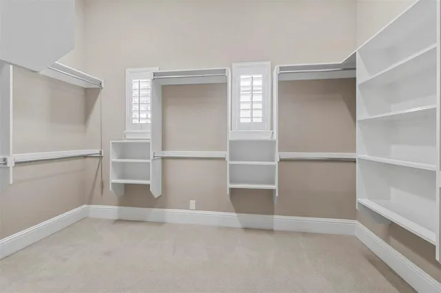 a view of an empty room with empty shelves