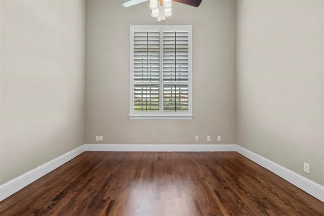 wooden floor and window in an empty room
