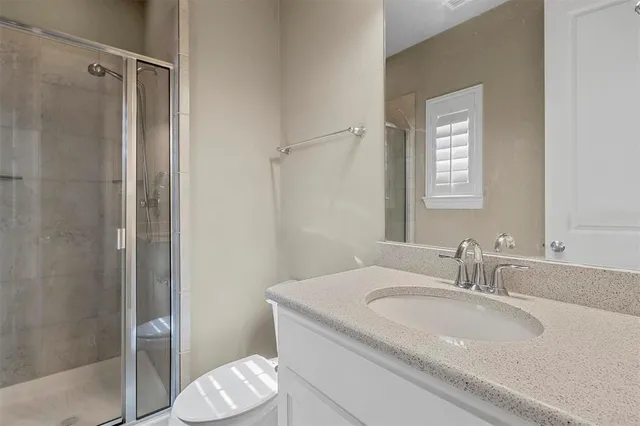 a view of a house with backyard and porch