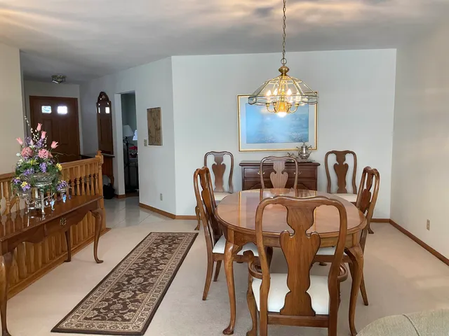 a view of a house with a wooden deck