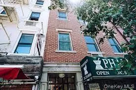 a front view of a building with retail shops