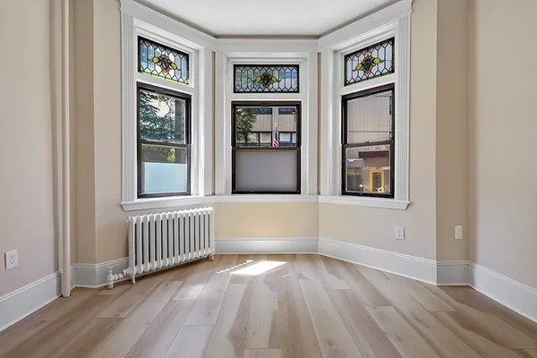 a view of livingroom with window and hardwood floor