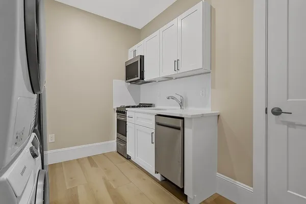 a view of storage and utility room with washer and dryer