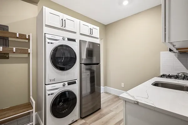 a utility room with dryer and washer
