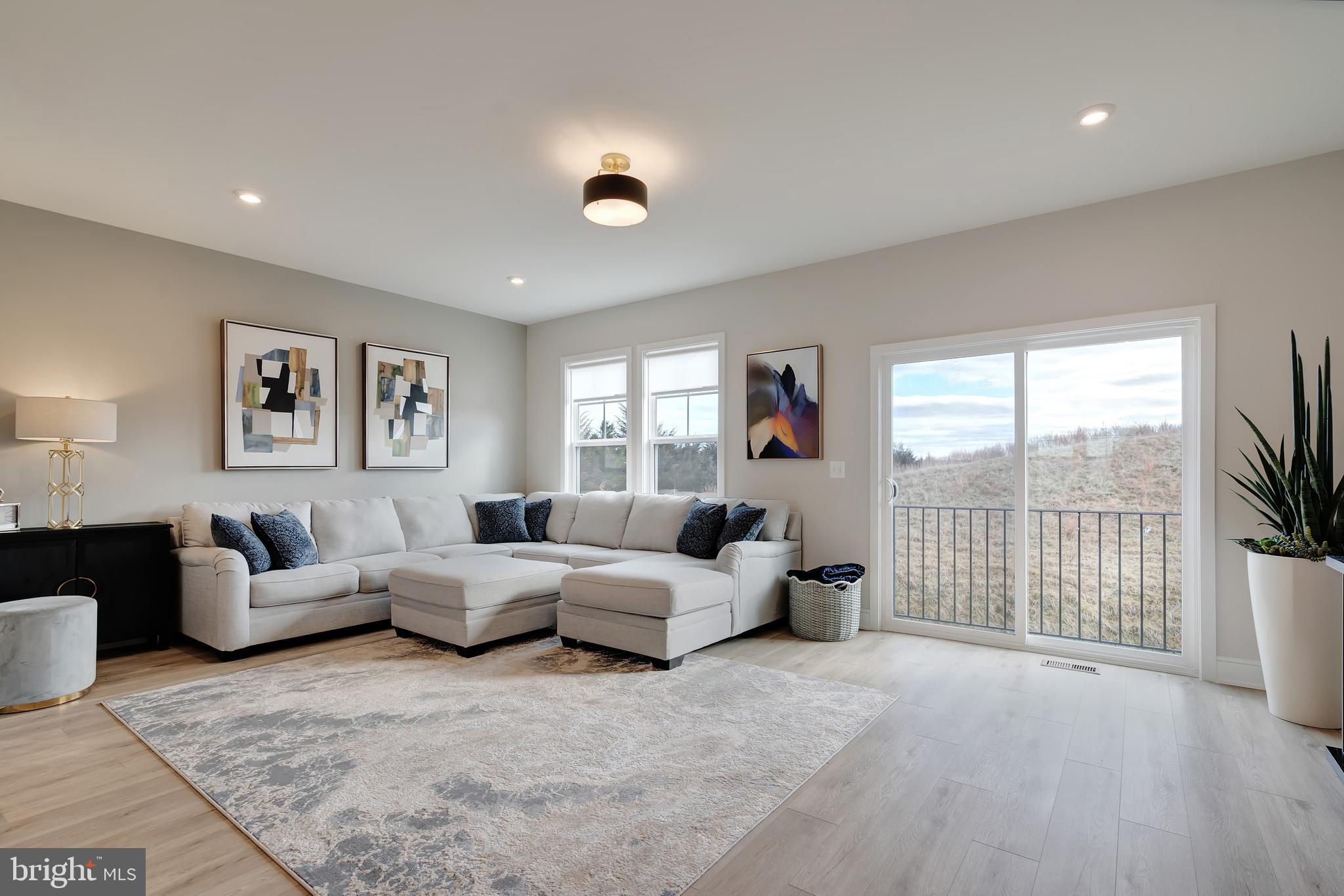 105 Checkerspot Way White Post, VA 22663 - Photo 11 of 37 a living room with furniture and a flat screen tv