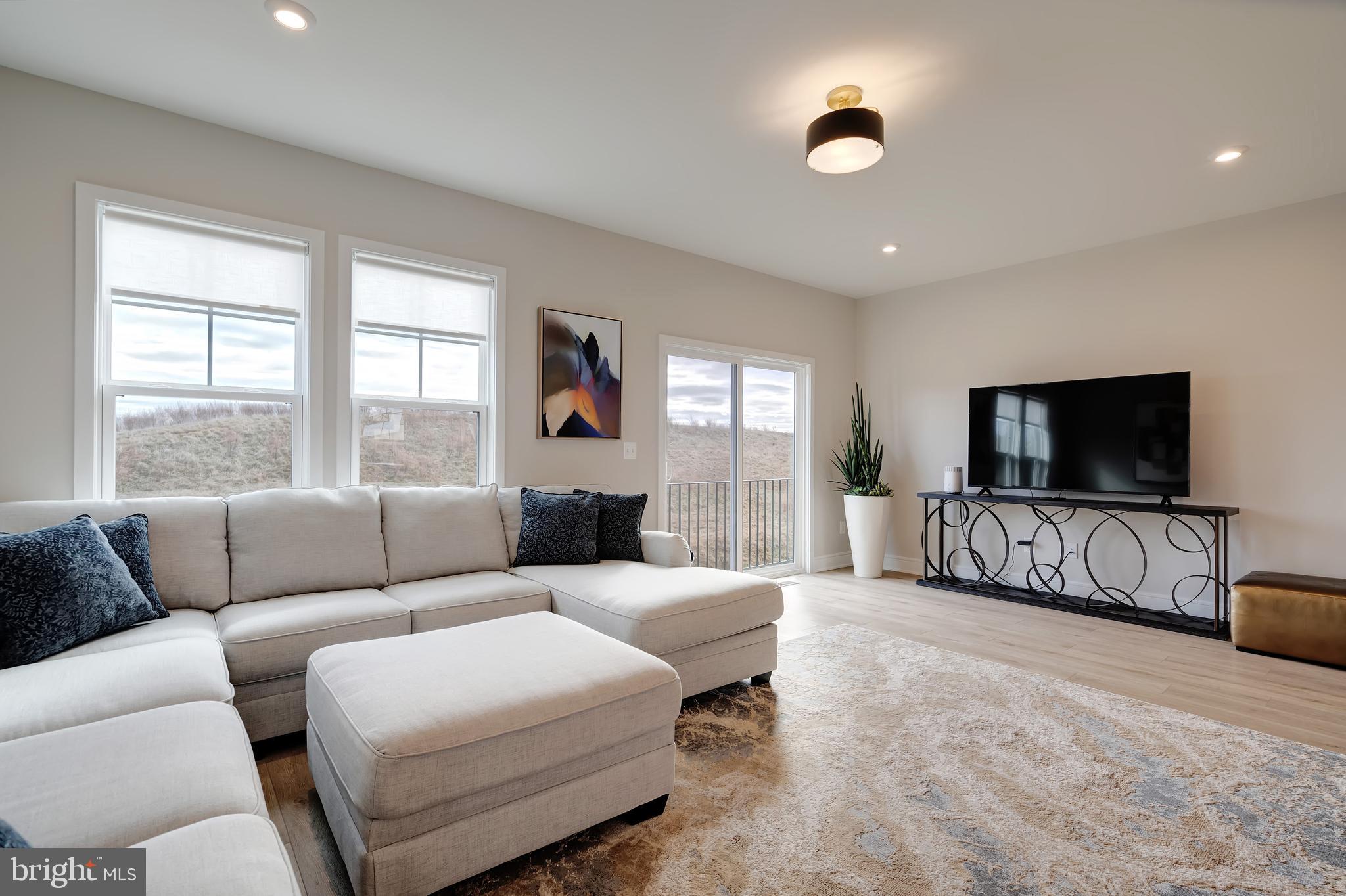 105 Checkerspot Way White Post, VA 22663 - Photo 13 of 37 a living room with furniture and a flat screen tv