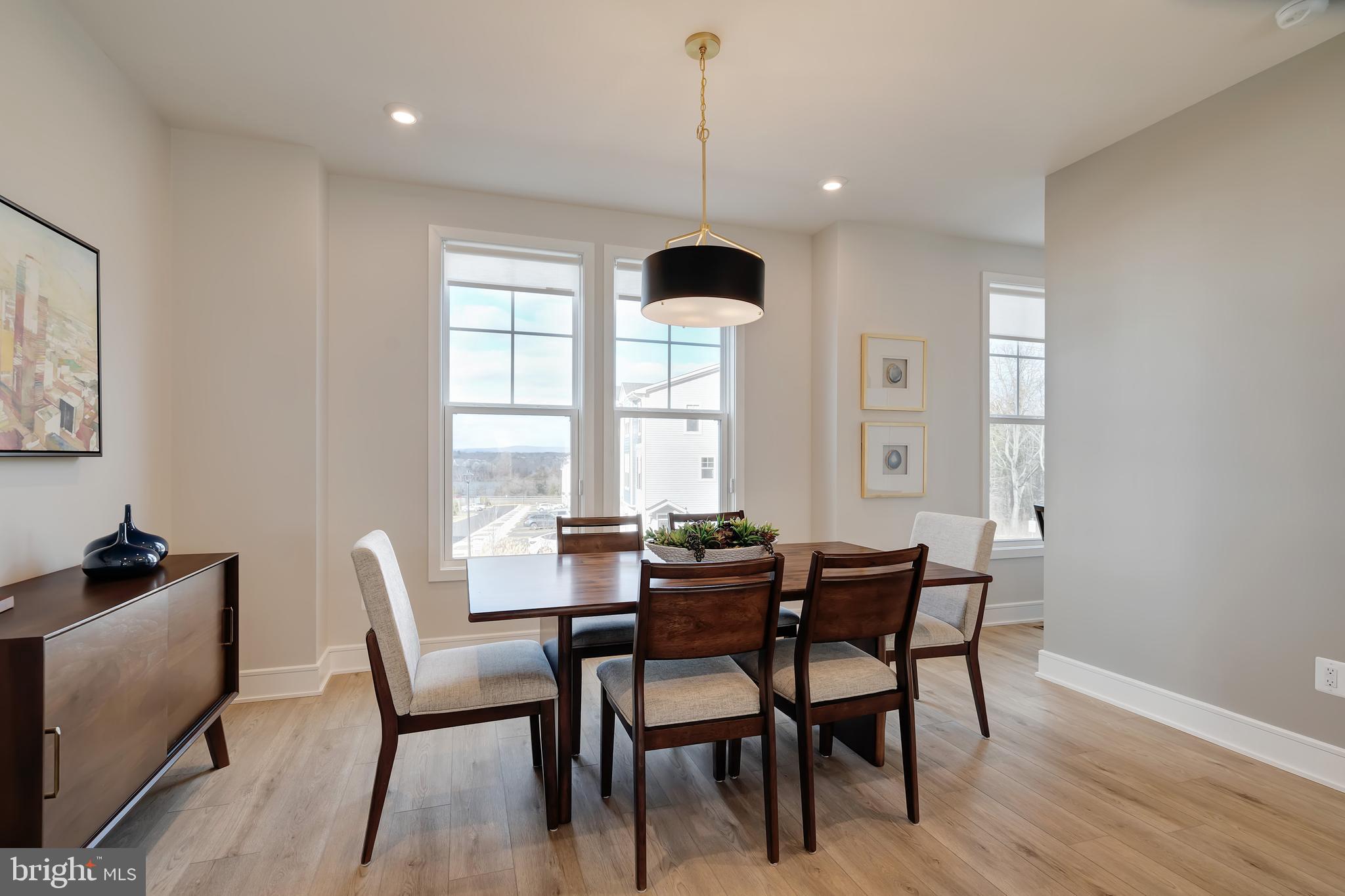 105 Checkerspot Way White Post, VA 22663 - Photo 19 of 37 a dining room with furniture a chandelier and wooden floor
