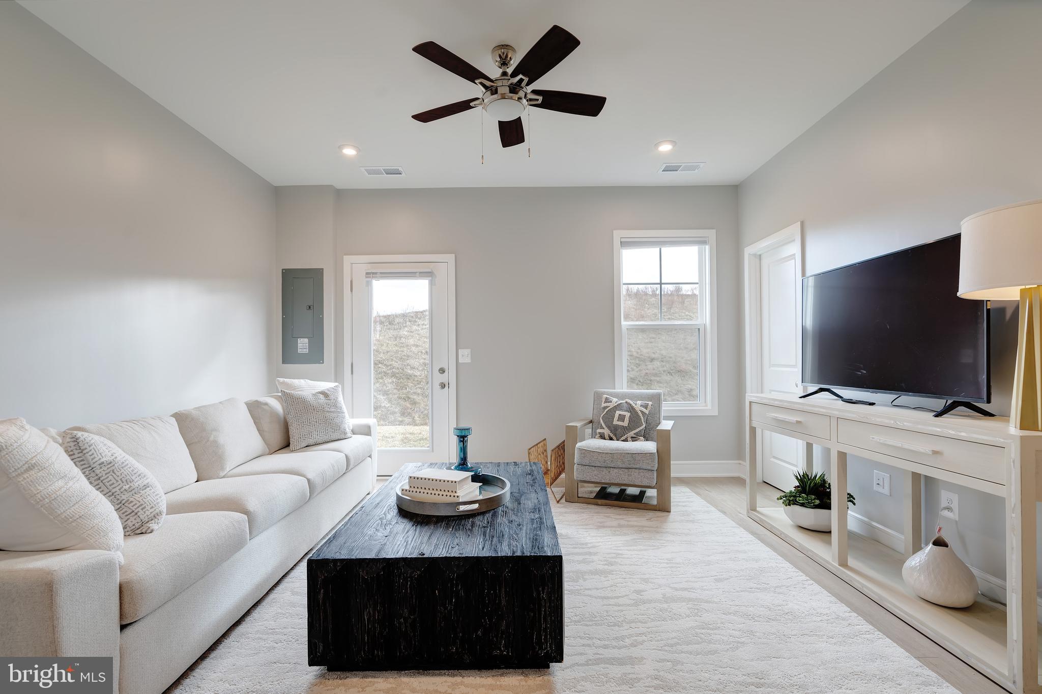 105 Checkerspot Way White Post, VA 22663 - Photo 5 of 37 a living room with furniture and a flat screen tv