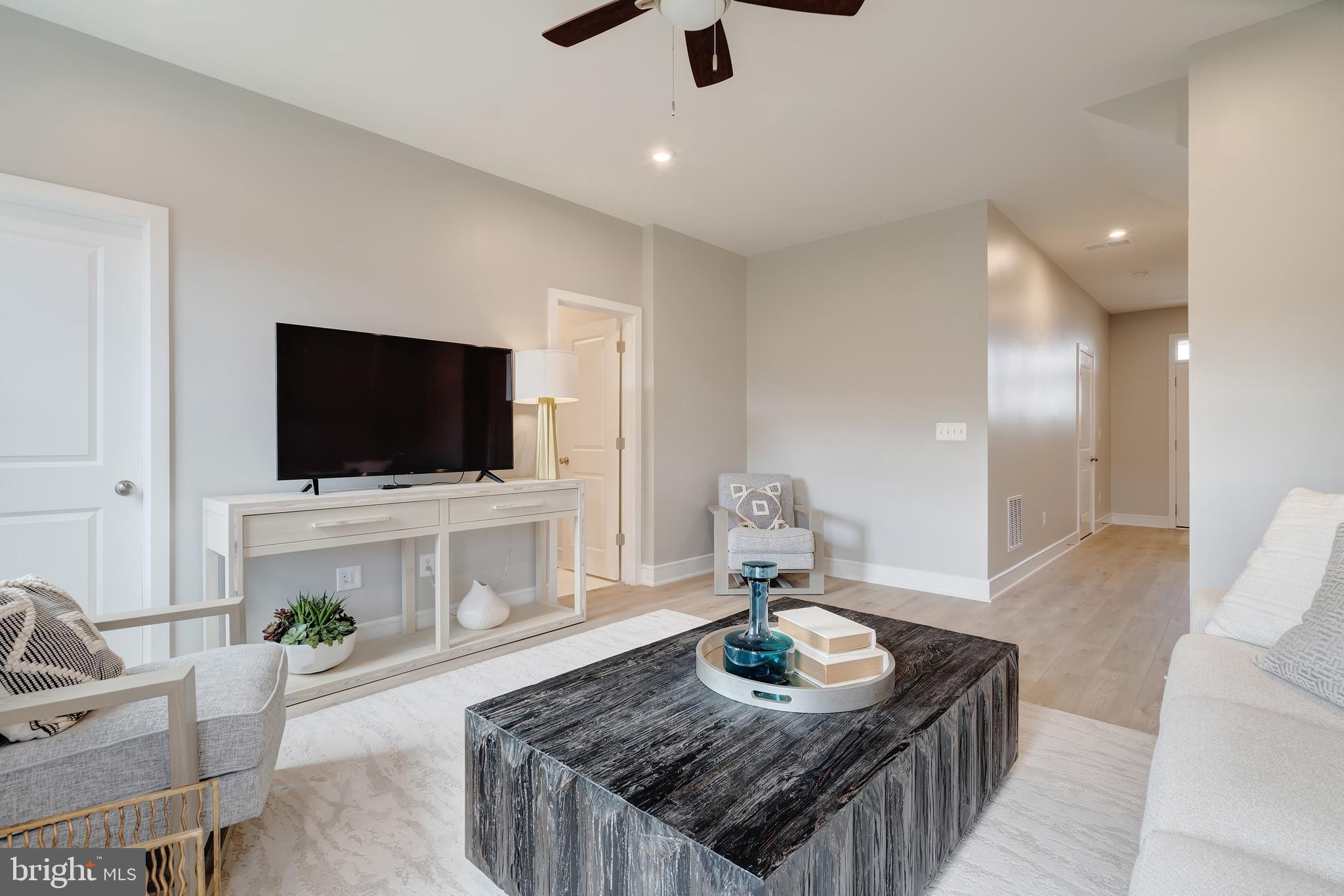 105 Checkerspot Way White Post, VA 22663 - Photo 6 of 37 a living room with furniture and a flat screen tv