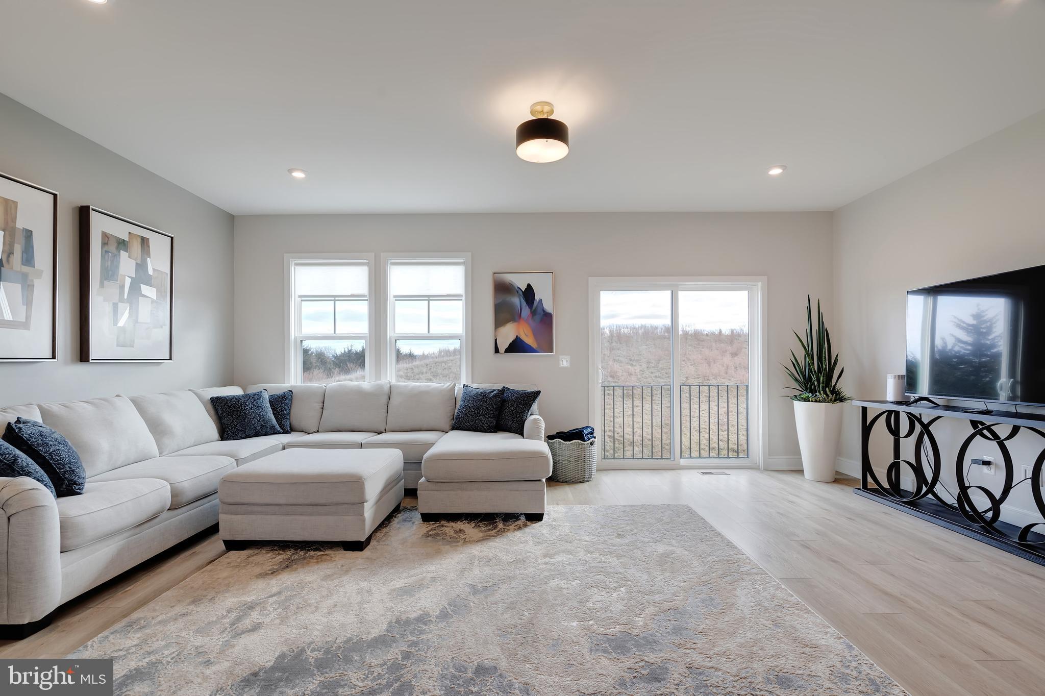 105 Checkerspot Way White Post, VA 22663 - Photo 10 of 37 a living room with furniture and a flat screen tv