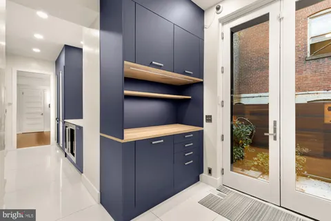 a kitchen with a wooden cabinets and a counter top space