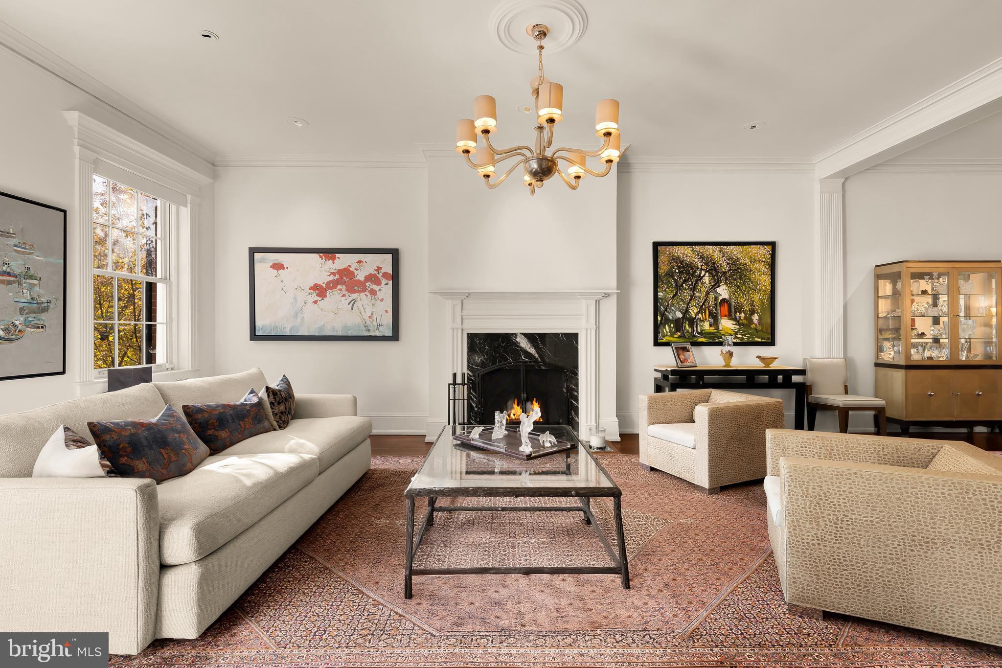 2137 R Street Northwest Washington, DC 20008 - Photo 3 of 42 a living room with furniture a chandelier and a fireplace