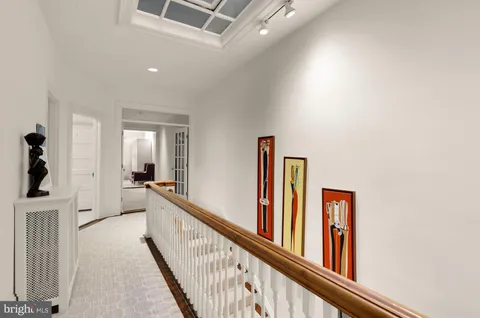 a view of a hallway with windows