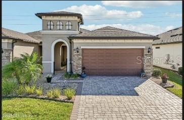 212 Rock Spring Loop St. Augustine, FL 32095 - Photo 1 of 1 a front view of a house with garden