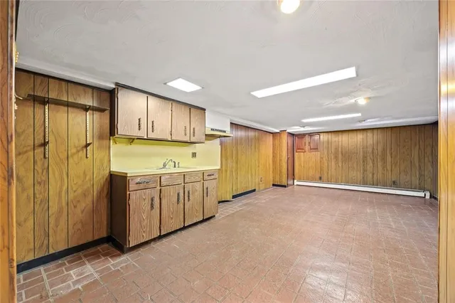 a view of an empty room with wooden walls