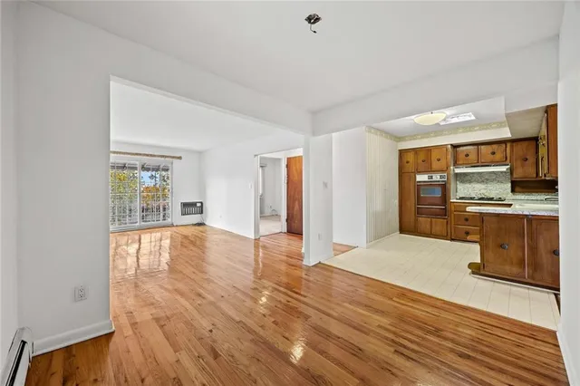 a view of a kitchen with wooden floor