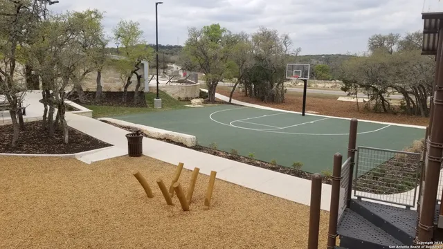 an aerial view of a house with outdoor space