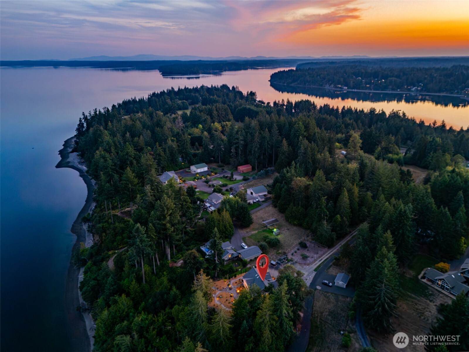 211 East Vineyard Crest Road Grapeview, WA 98546 - Photo 5 of 34 a view of a lake and sunset