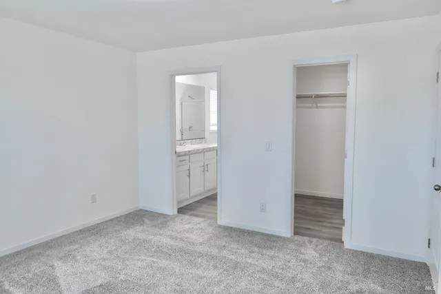 an empty room with closet area