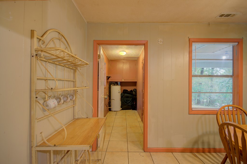 92 No-Where Road Blairsville, GA 30512 - Photo 7 of 36 a view of a hallway with wooden floor and a bathroom