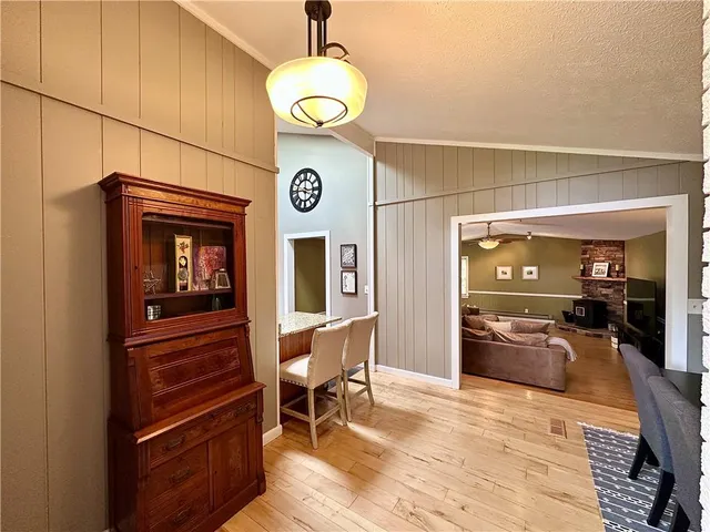 a dining room with furniture and wooden floor
