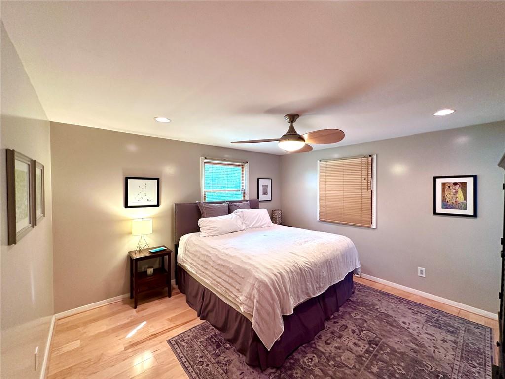 927 Chippewa Trail Mercer, PA 16137 - Photo 40 of 48 a bedroom with a large bed and a chandelier