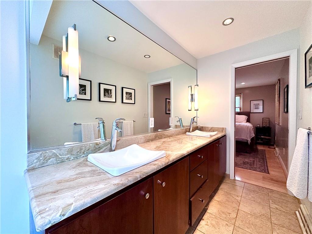 927 Chippewa Trail Mercer, PA 16137 - Photo 41 of 48 a spacious bathroom with a granite countertop sink and a mirror