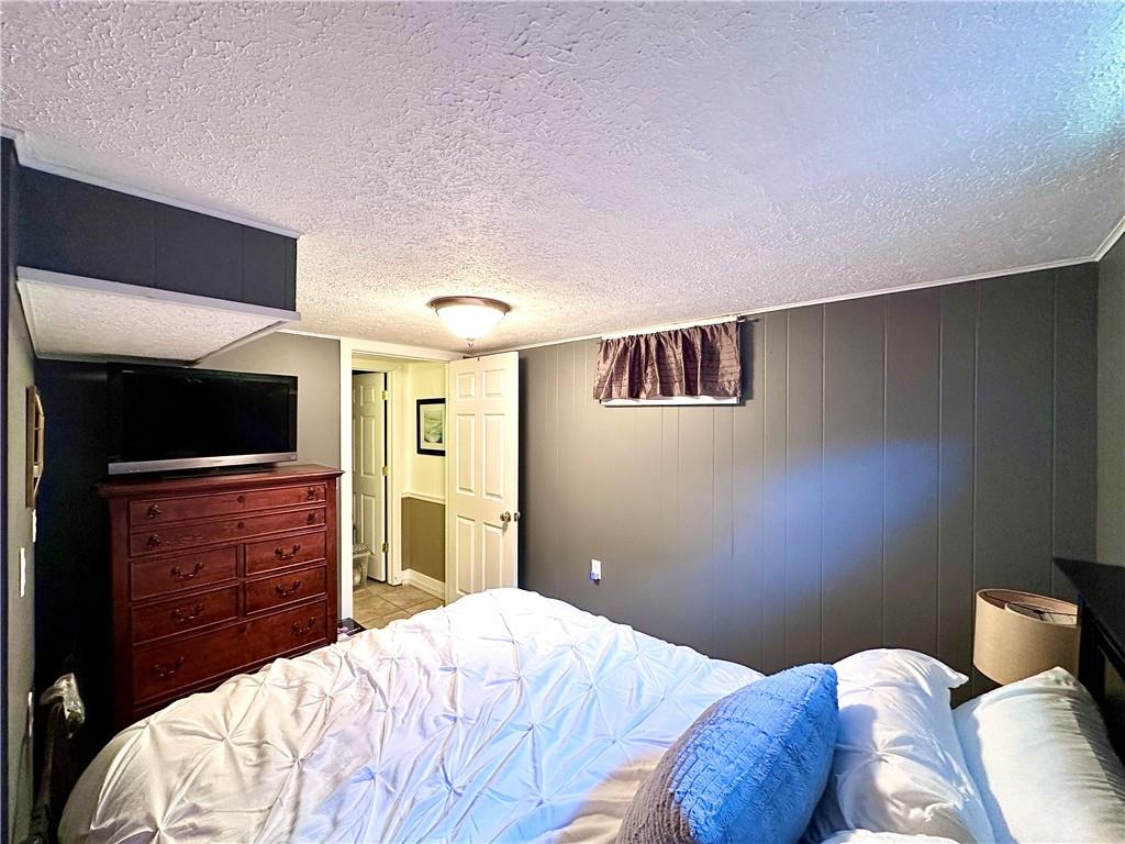 927 Chippewa Trail Mercer, PA 16137 - Photo 48 of 48 a bedroom with a bed and a television