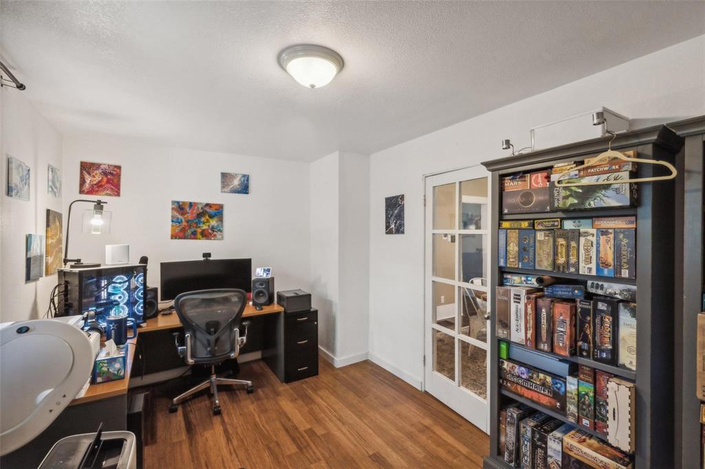 201 Shaffner Street Ponder, TX 76259 - Photo 16 of 40 a view of a workspace with furniture and toys