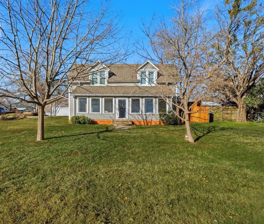 201 Shaffner Street Ponder, TX 76259 - Photo 2 of 40 a front view of a house with a yard