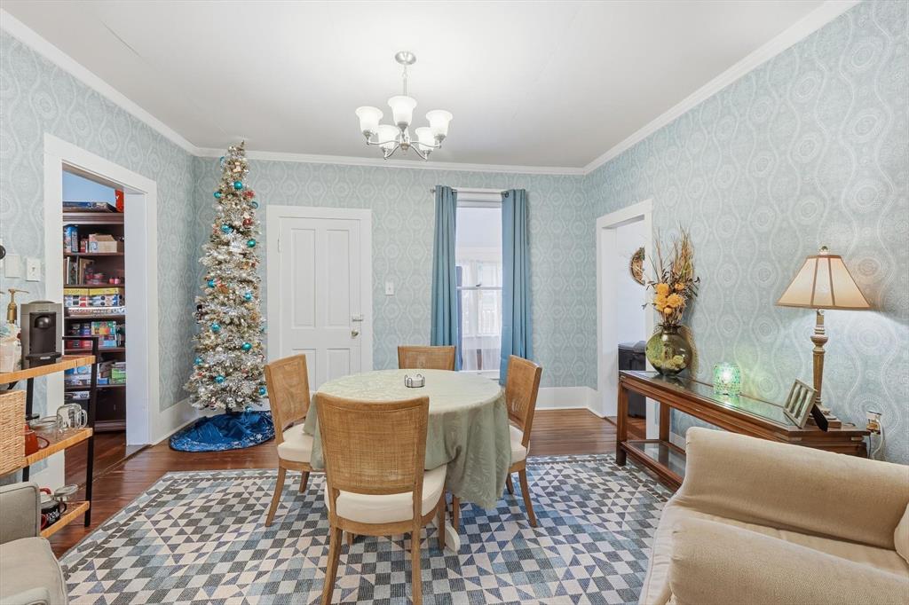201 Shaffner Street Ponder, TX 76259 - Photo 21 of 40 a dining room with furniture a chandelier and window