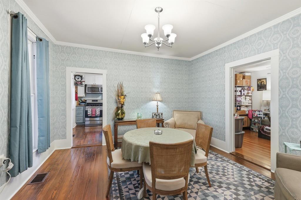 201 Shaffner Street Ponder, TX 76259 - Photo 22 of 40 a view of a dining room with furniture and wooden floor