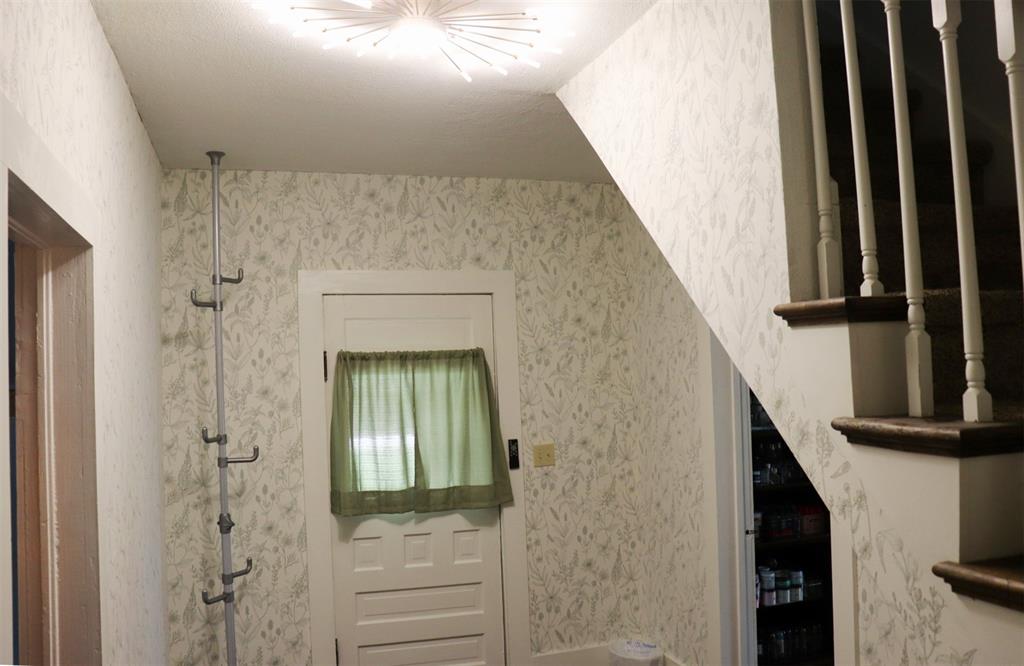 201 Shaffner Street Ponder, TX 76259 - Photo 24 of 40 a view of a livingroom with wooden floor and staircase