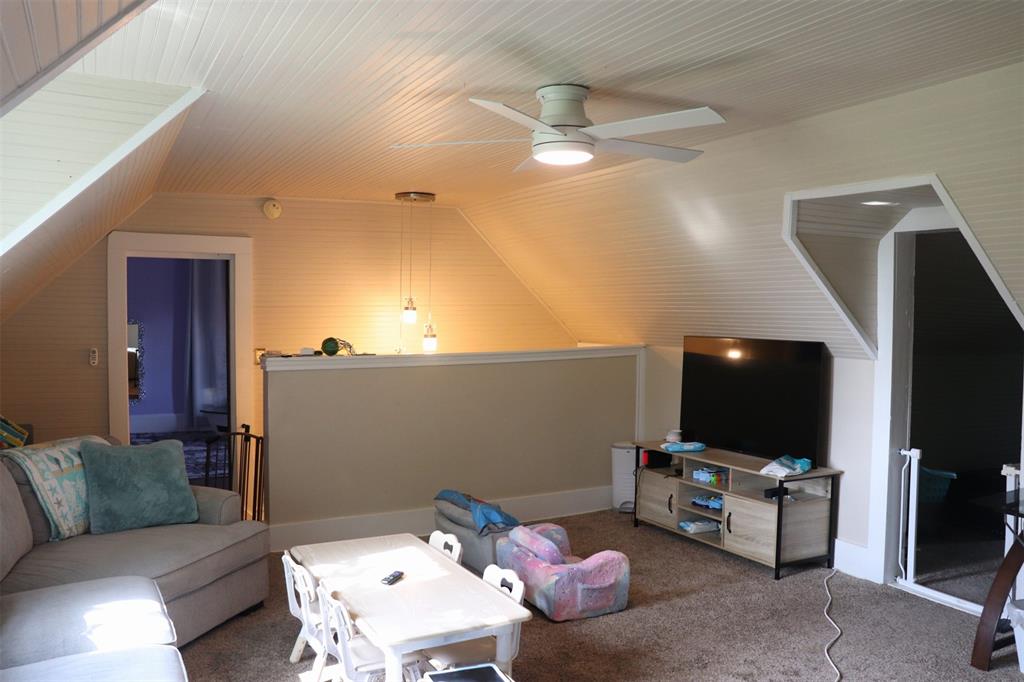 201 Shaffner Street Ponder, TX 76259 - Photo 30 of 40 a living room with furniture and a flat screen tv