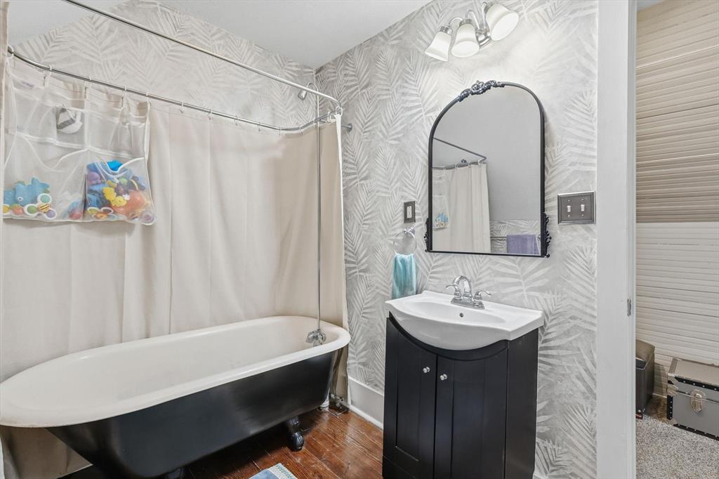 201 Shaffner Street Ponder, TX 76259 - Photo 35 of 40 a bathroom with a sink and a mirror