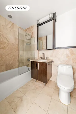 a spacious bedroom with two beds and a large window