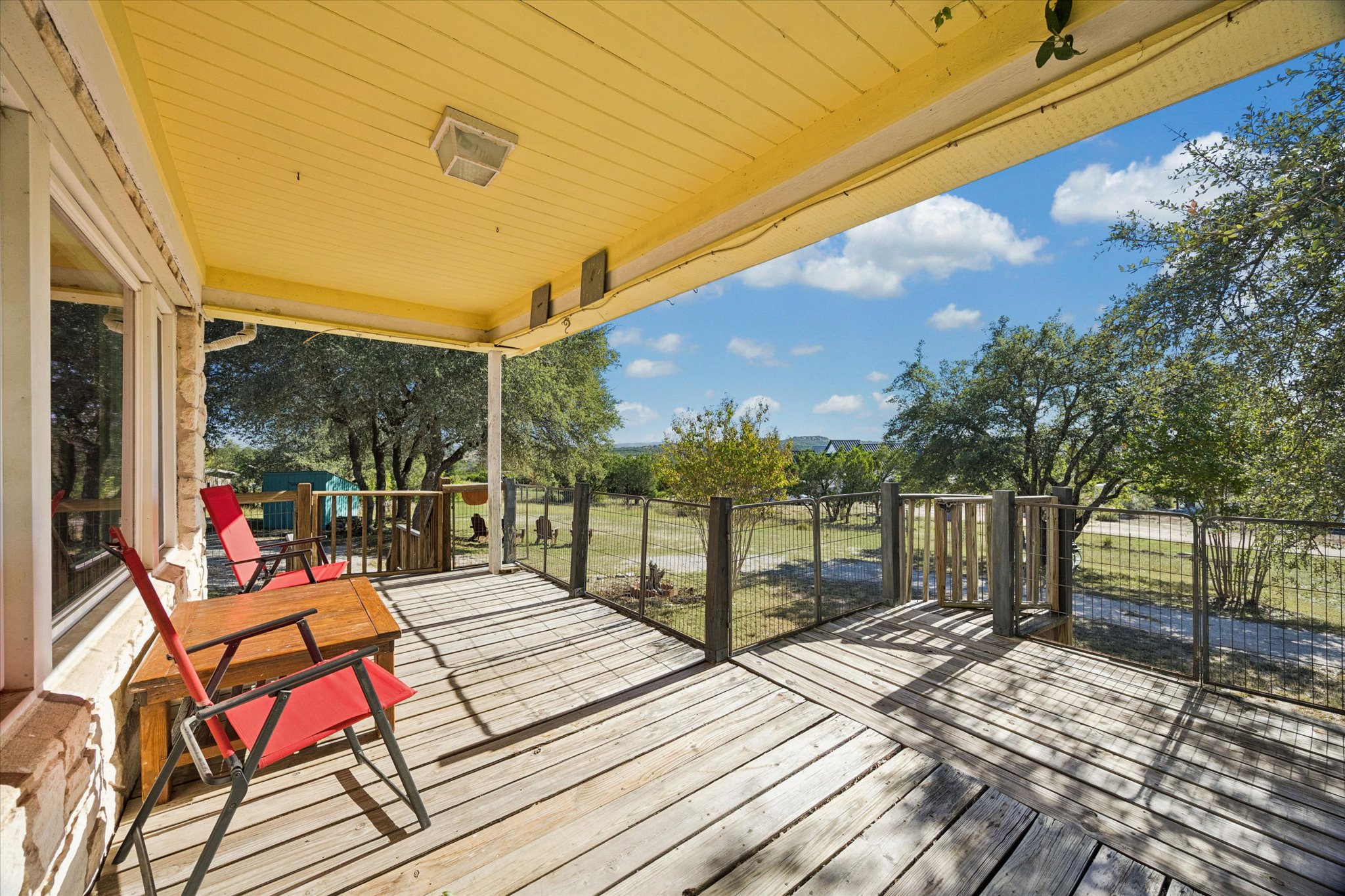1091 Alta Vista Road Spicewood, TX 78669 - Photo 13 of 28 a balcony with chairs and a table