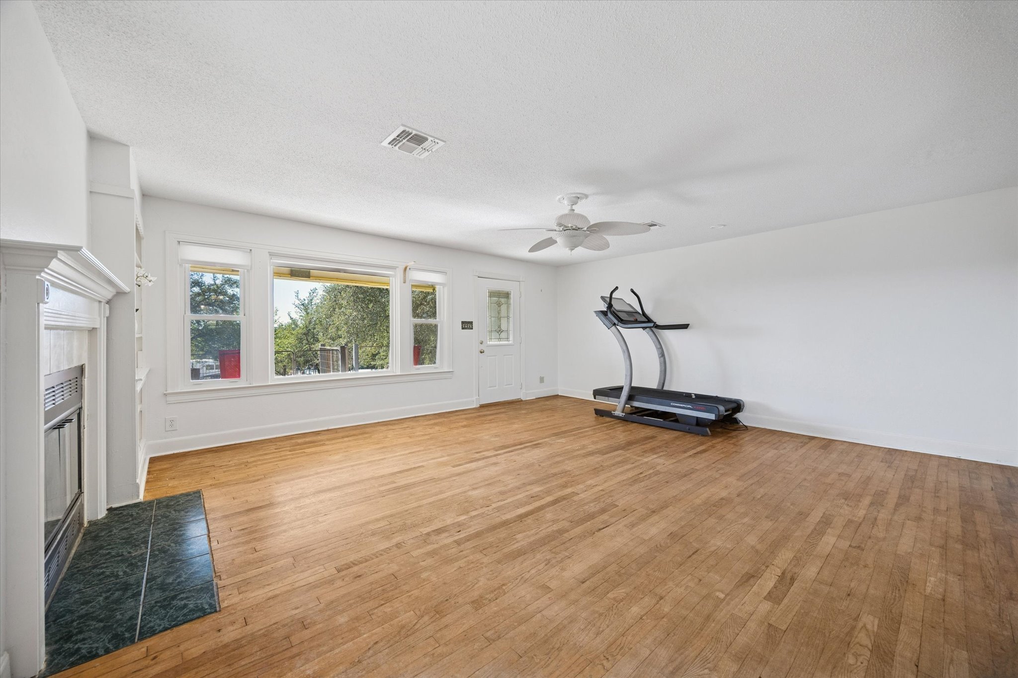 1091 Alta Vista Road Spicewood, TX 78669 - Photo 15 of 28 a view of a room with gym equipment and a window