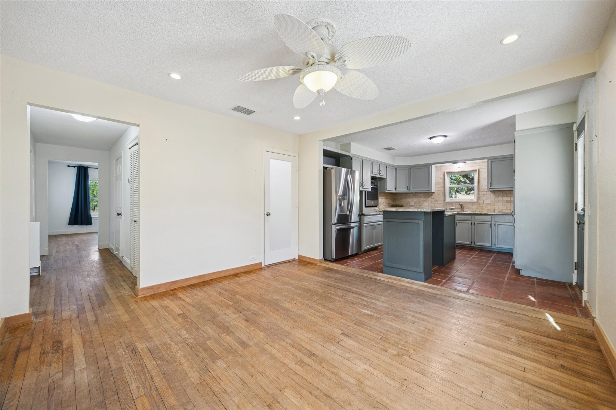1091 Alta Vista Road Spicewood, TX 78669 - Photo 16 of 28 a view of a kitchen with wooden floor