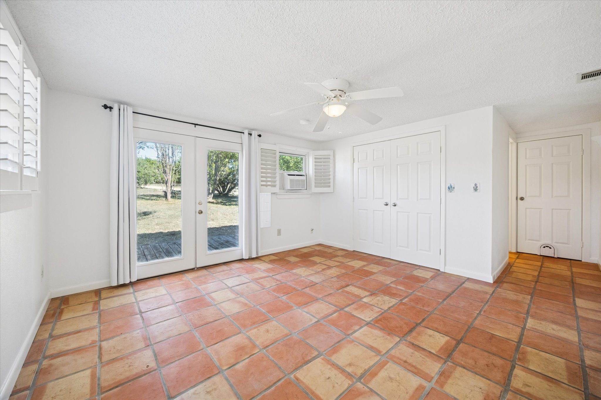 1091 Alta Vista Road Spicewood, TX 78669 - Photo 26 of 28 a view of an empty room with a window