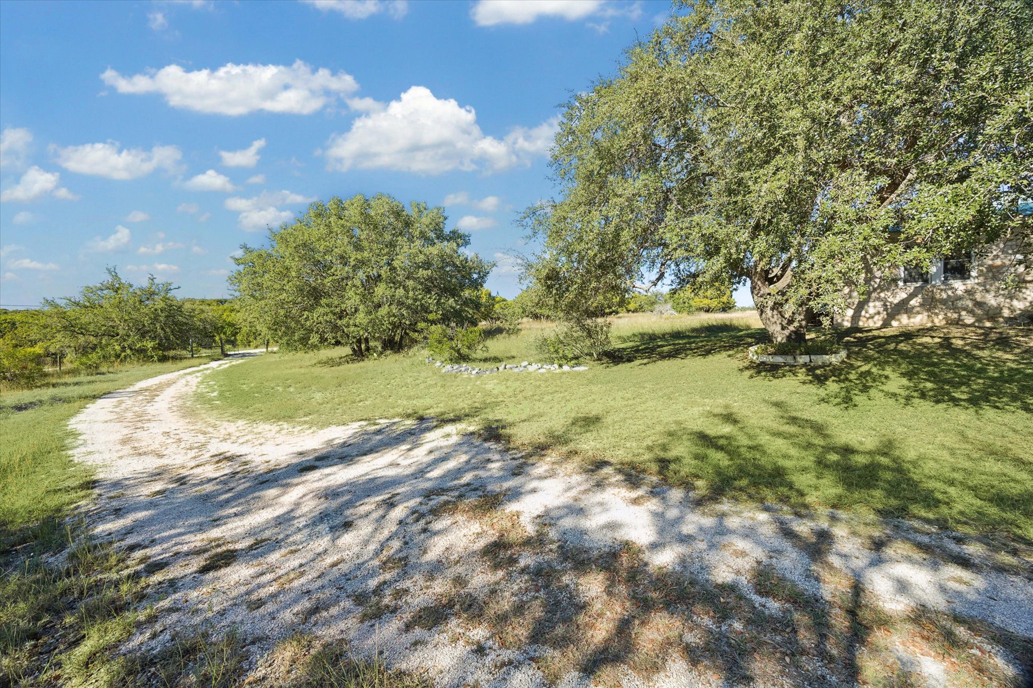 1091 Alta Vista Road Spicewood, TX 78669 - Photo 4 of 28 a view of a trees with a yard