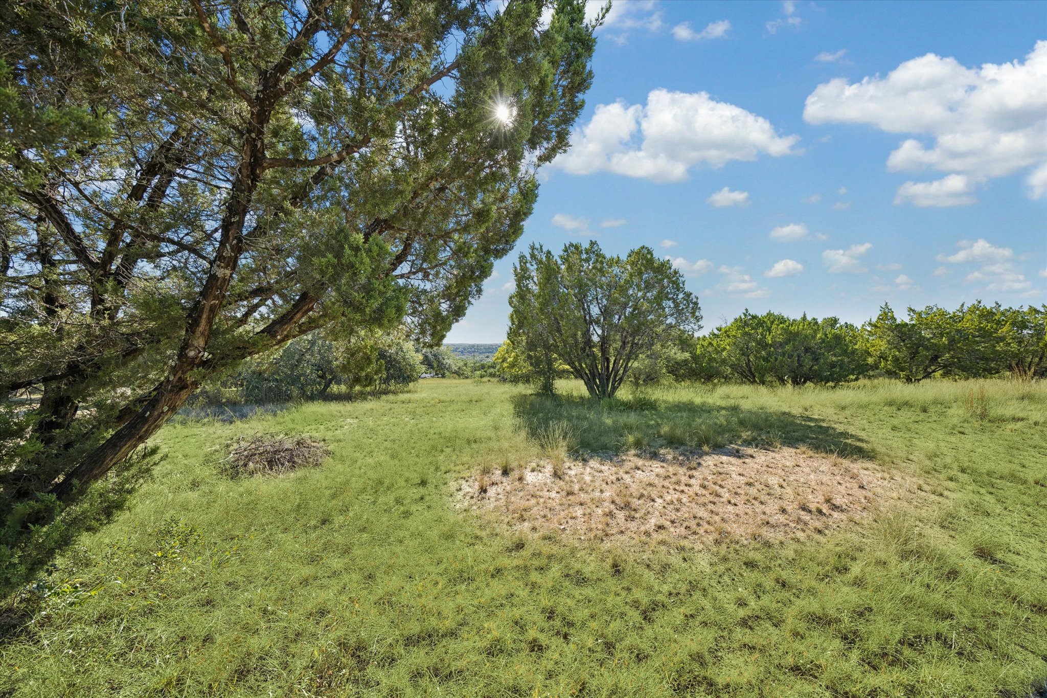1091 Alta Vista Road Spicewood, TX 78669 - Photo 6 of 28 a view of lake with green space